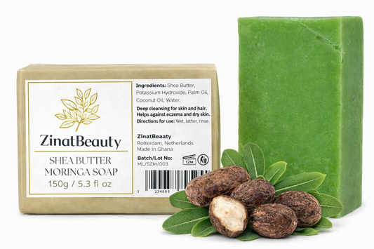 Green bar of soap with Zinal Beauty branding, shea butter, and leaves on a white background