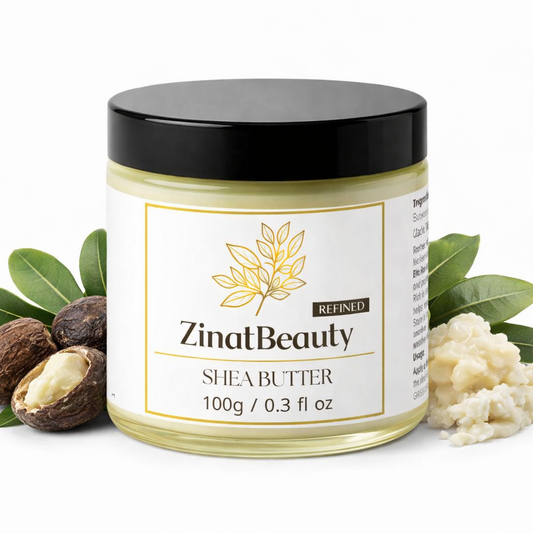 Jar of ZinatBeauty shea butter with leaves and shea nuts on a white background